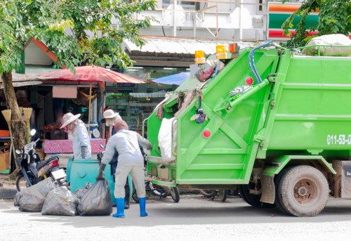 Workers sorting building materials for recycling